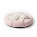 Cozy Cloud Cat Bed in soft pink color with a fluffy white cat sleeping inside